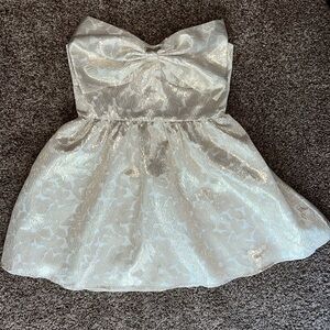 Strapless metallic bow dress